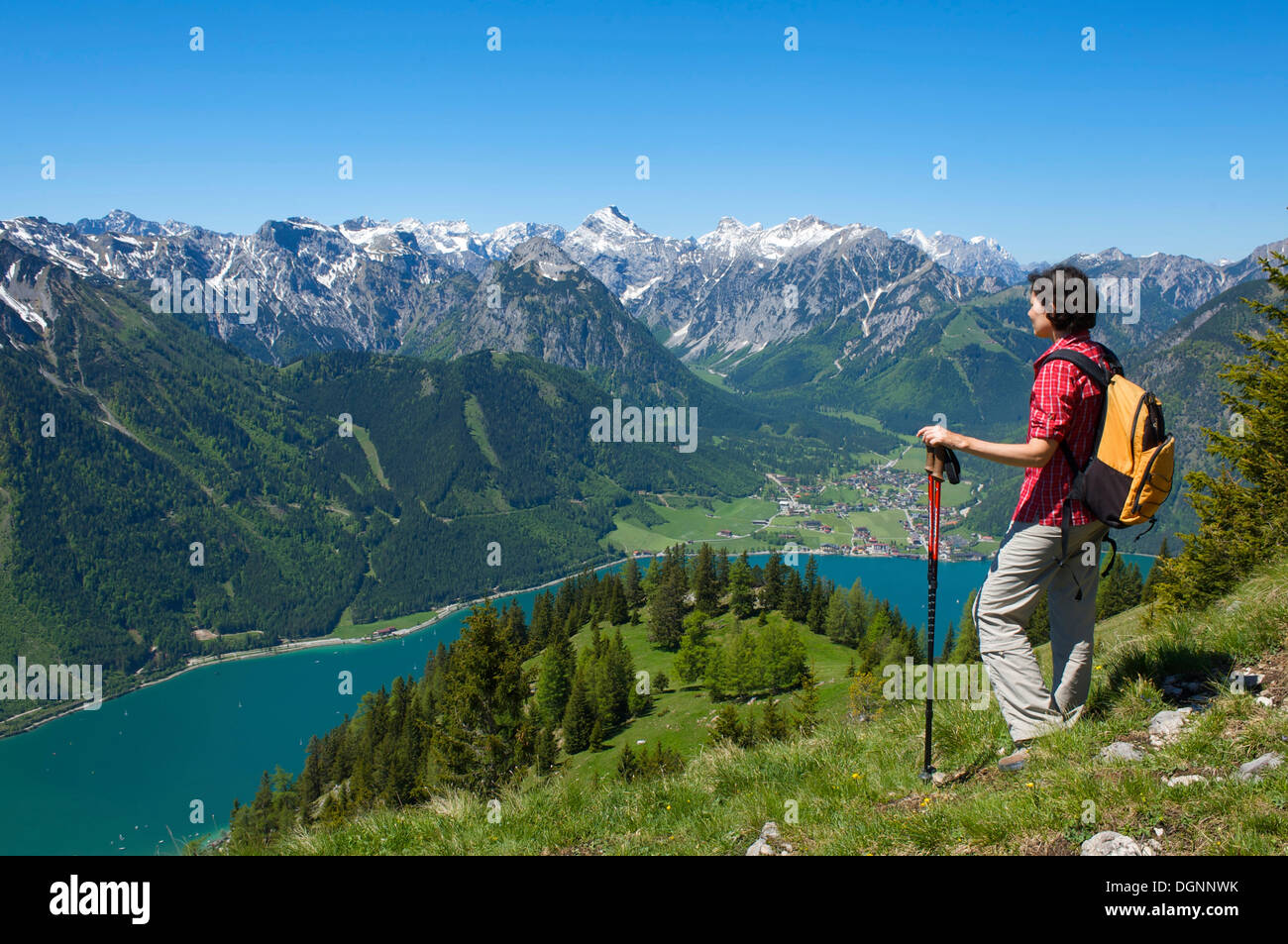 Hiker looking from the Durrakreuz viewing point on Lake Achensee, Tyrol ...