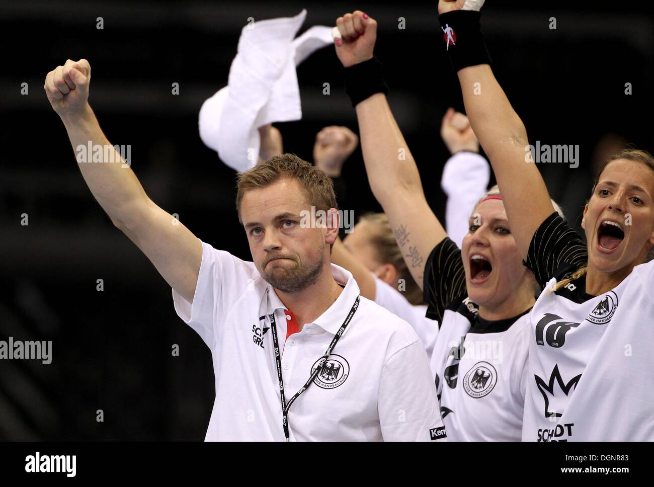 Trier, Germany. 23rd Oct, 2013. Germany's Heine Jensen celebrates with Anja Althaus (C) and Laura Steinbach (R) scores a goal during the handball European qualitification match at the Arena in Trier, Germany, 23 October 2013. Photo: THOMAS FREY/dpa/Alamy Live News Stock Photo