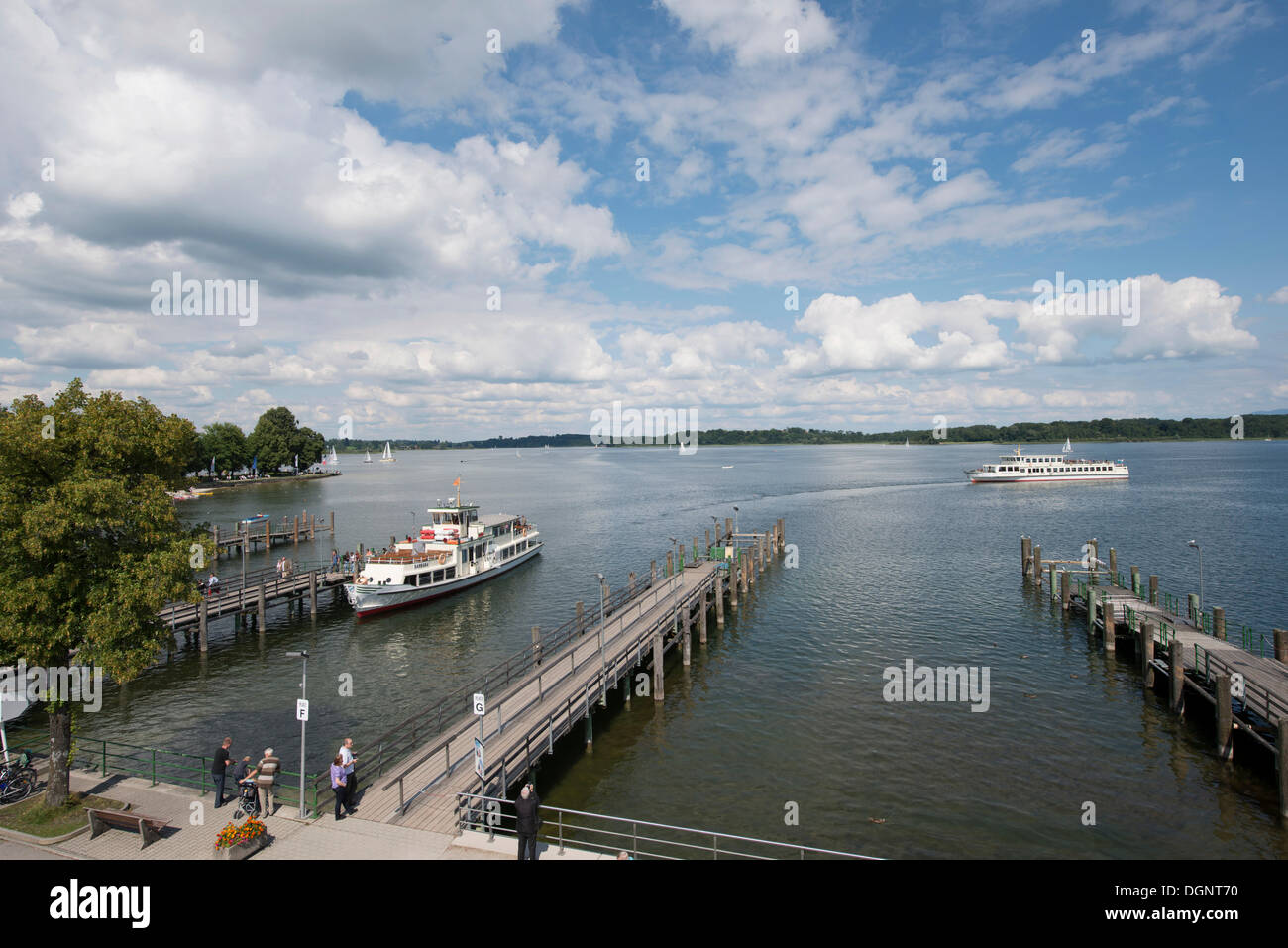 A steamboat at a landing stage on lake Chiemsee, Insel Herrenchiemsee, Prien am Chiemsee, Bavaria, Germany Stock Photo