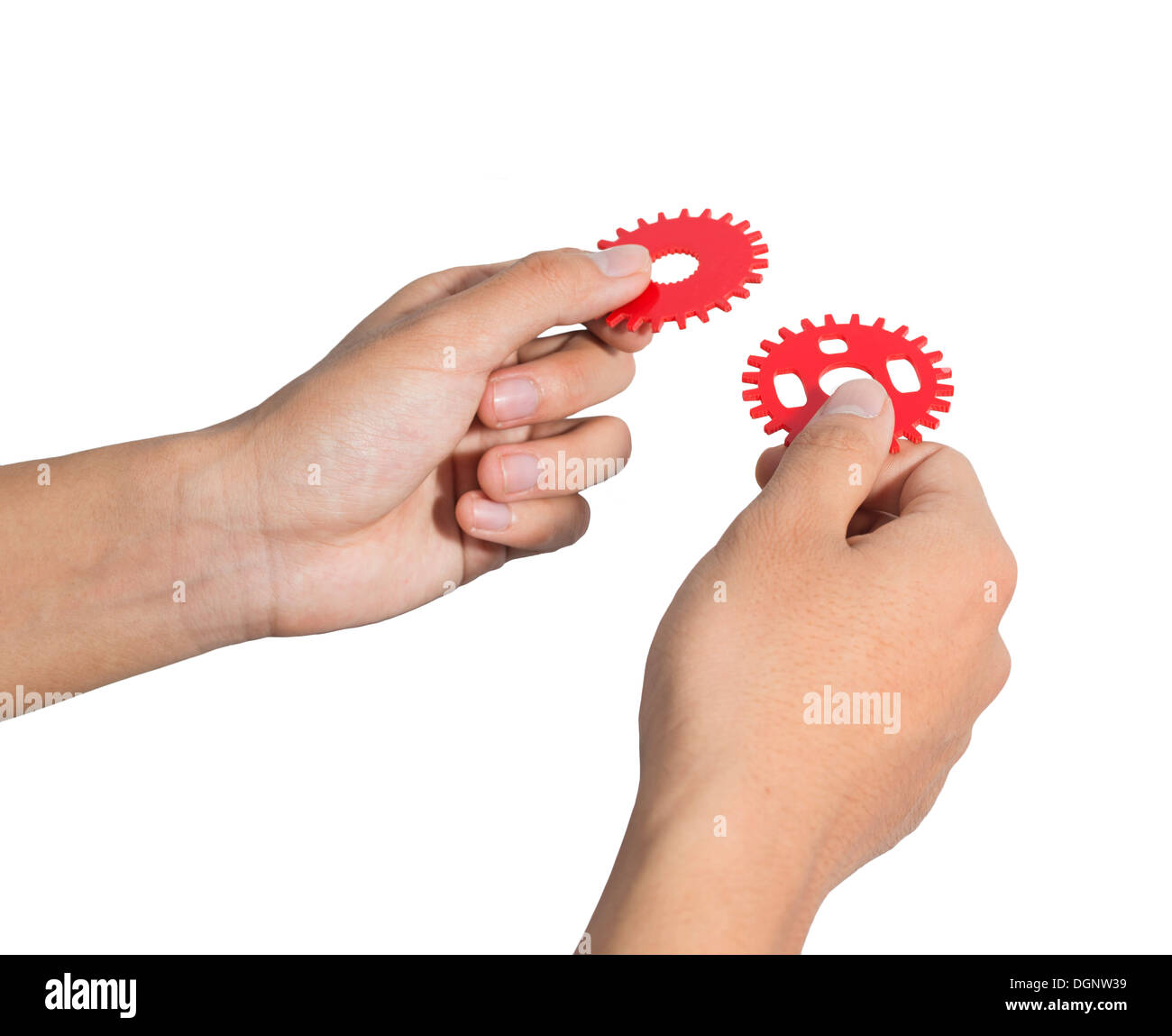 Man designing a mechanic system with red cog gear wheels. Stock Photo