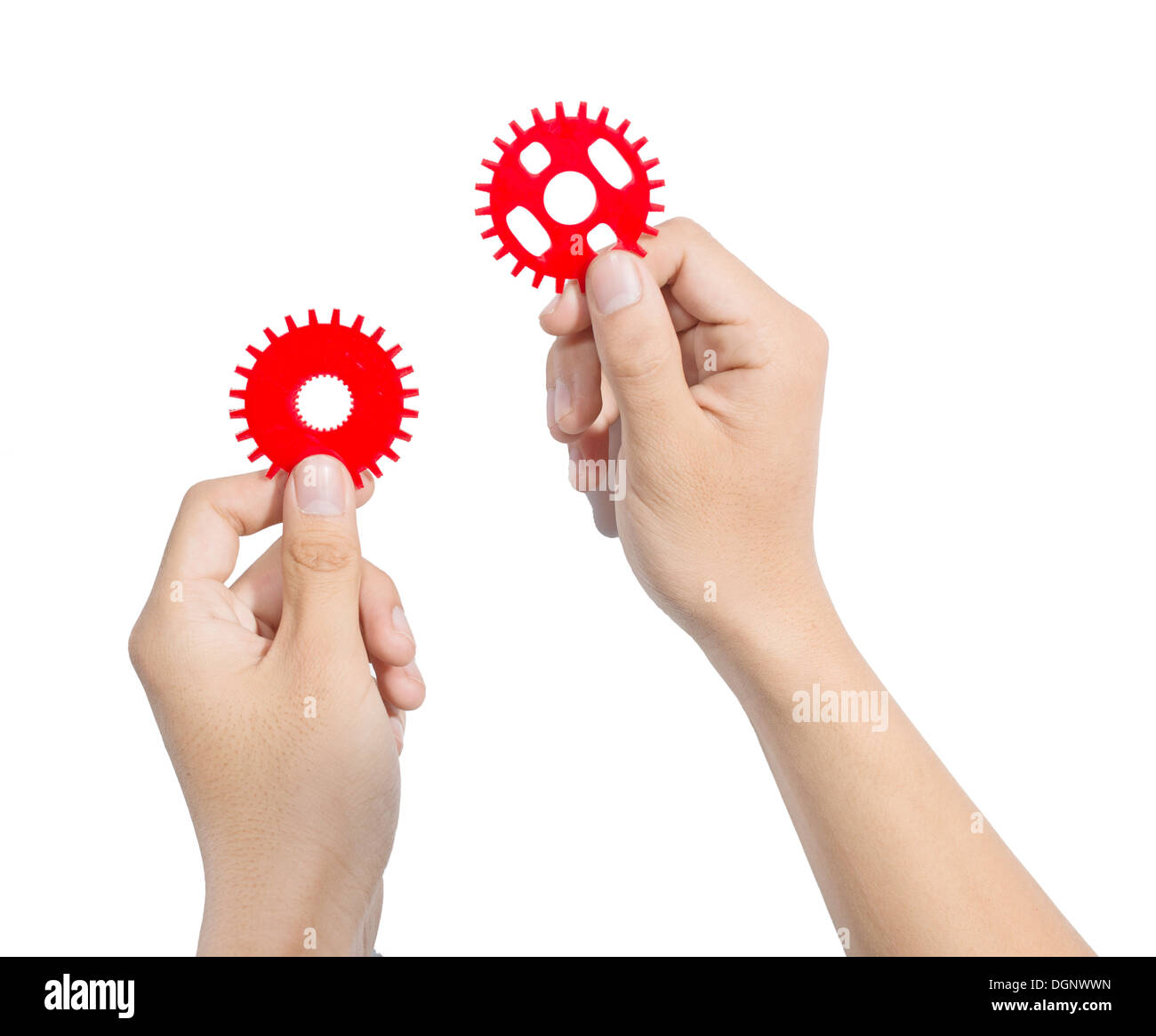 Man designing a mechanic system with red cog gear wheels. Stock Photo