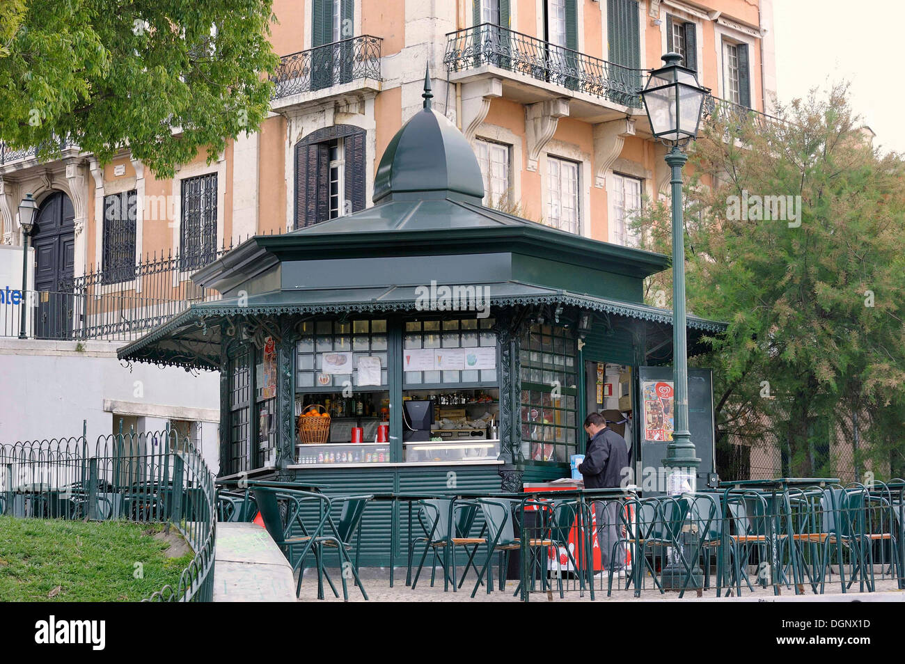 A typical cast iron polygonal kiosk, chairs and tables standing in front of it, Bairro Alto, Lisbon, Portugal, Europe Stock Photo