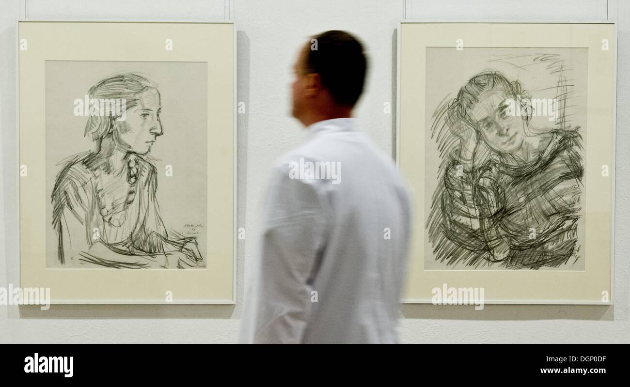 Frankfurt Oder, Germany. 24th Oct, 2013. Employee Ingo Kallis looks at pictures by Oskar Kokoschka (1886-1980) in the exhibition 'Degenerate Art' at the Museum Junge Kunst in Frankfurt Oder, Germany, 24 October 2013. In 1937, the Nazis held an art exhibition in Munich of what they considered to be 'degenerate art.' The museum is showing a portion of these works from 27 October 2013 until 26 January 2013. Photo: PATRICK PLEUL/dpa/Alamy Live News Stock Photo