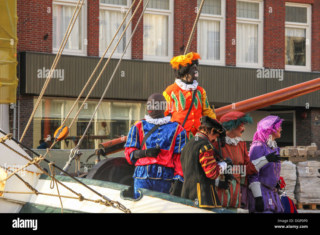 Sinterklaas arrives in the harbor of Groningen with his 'Zwarte Pieten' of which some are black and some are white. Stock Photo
