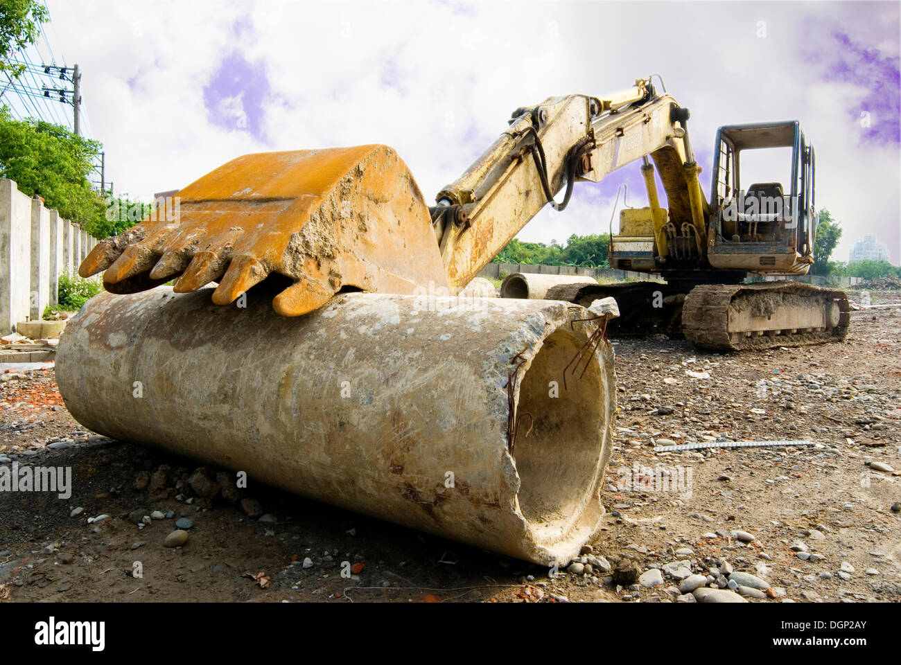 Excavator shovel on cement tube hires stock photography and images Alamy