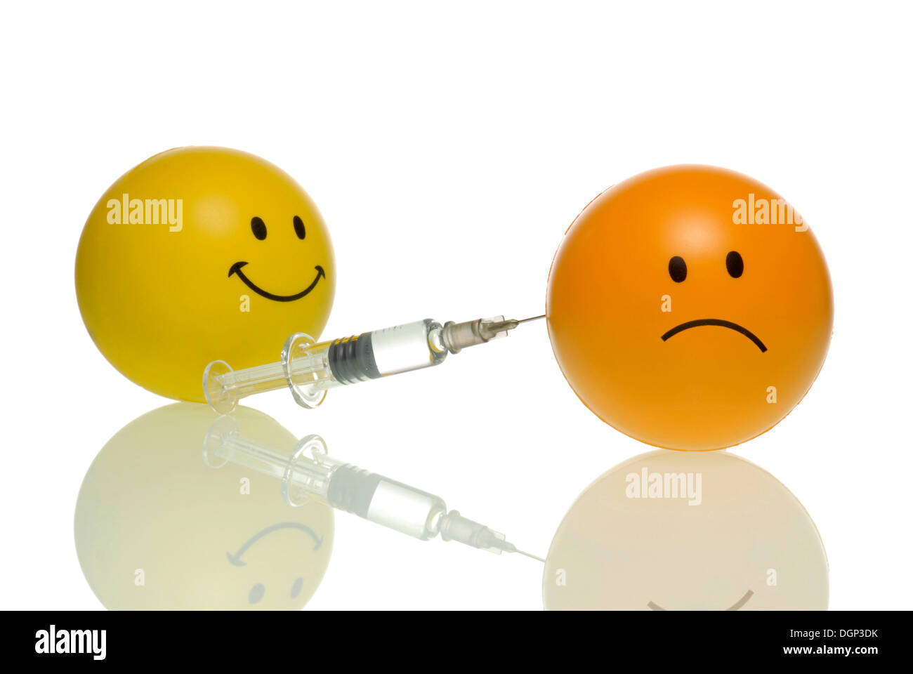 A smiley injects a frowning smiley, frownie, symbolic image against flu shots Stock Photo