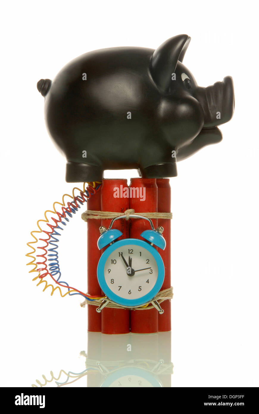 Piggy bank on a bomb, symbolic image for risky savings Stock Photo