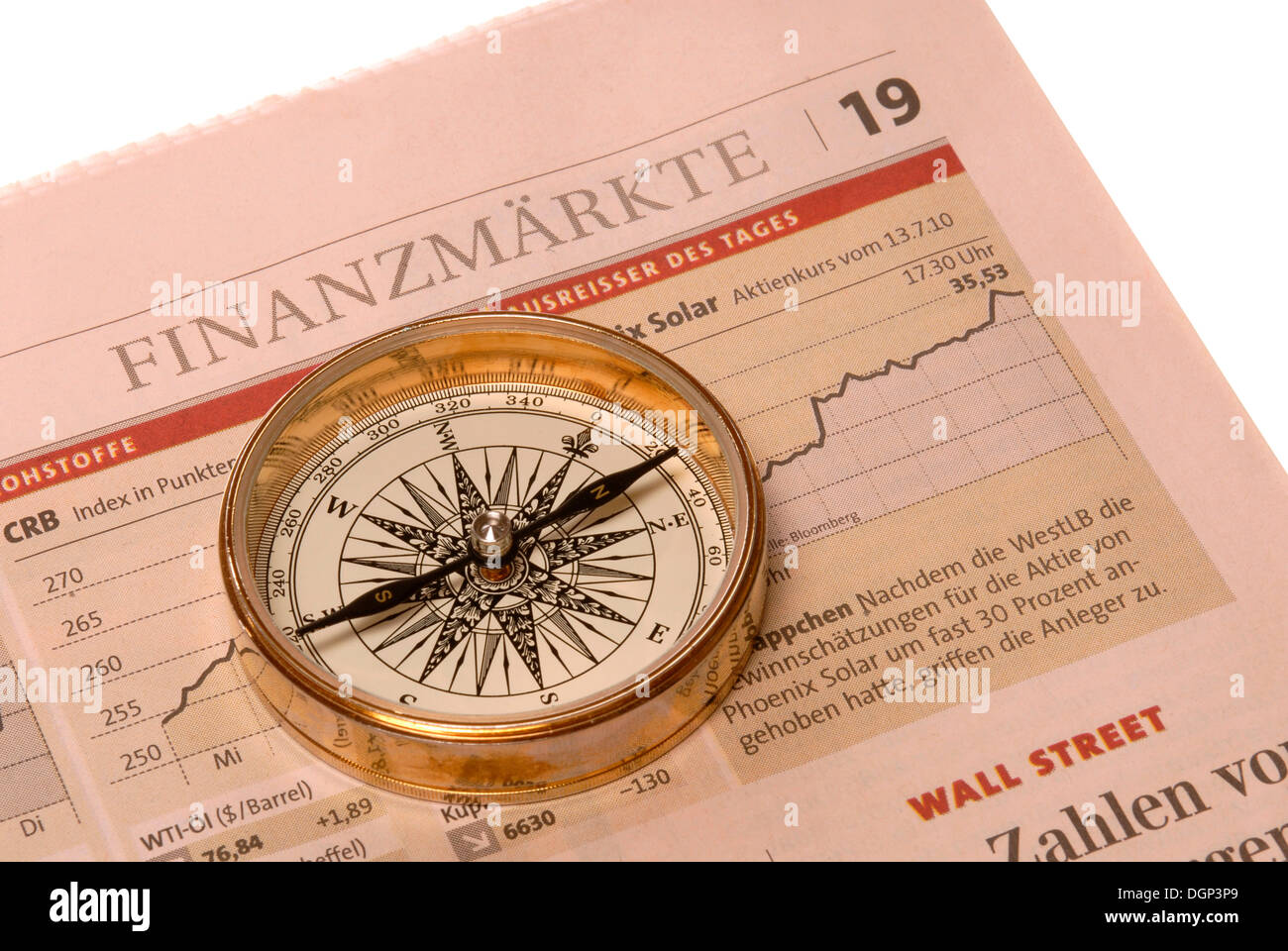 Compass on business newspaper, symbolic image for German economy Stock Photo