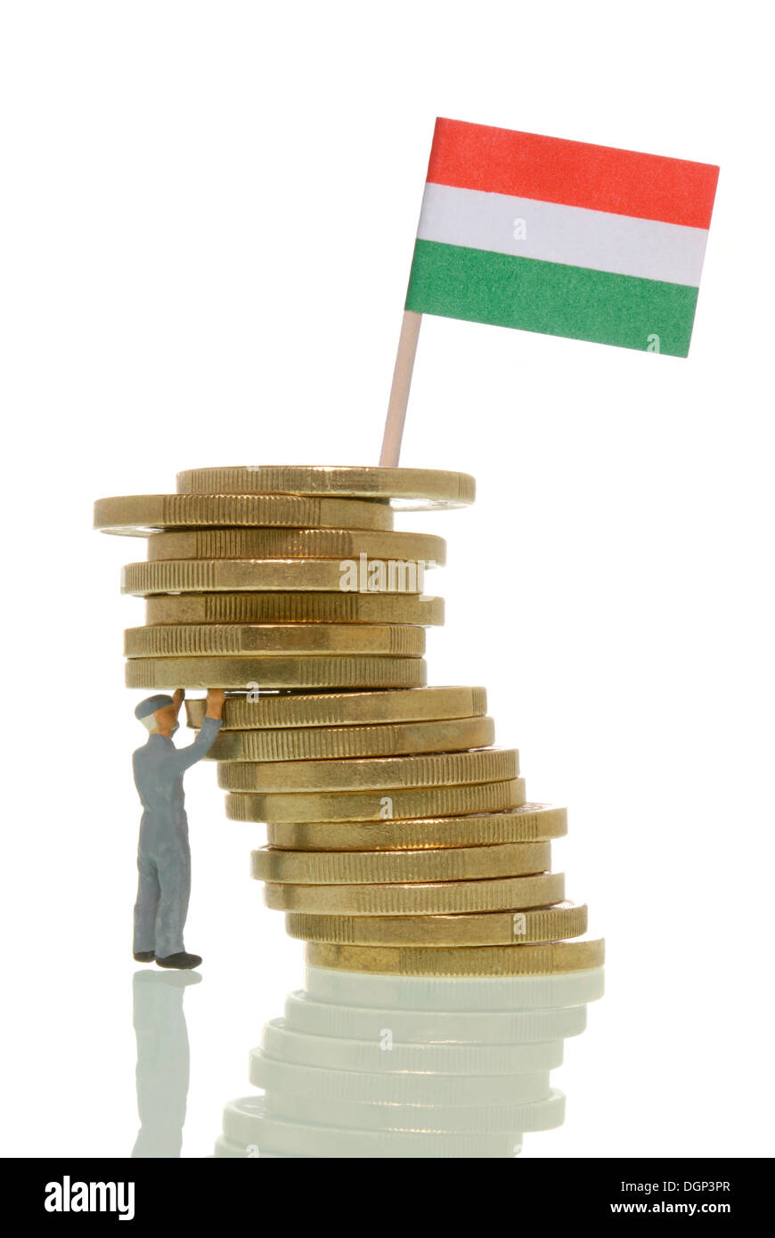 Worker figure propping up a wobbly stack of Euros with a Hungarian flag on top, symbolic image, Euro crisis impacting the Stock Photo