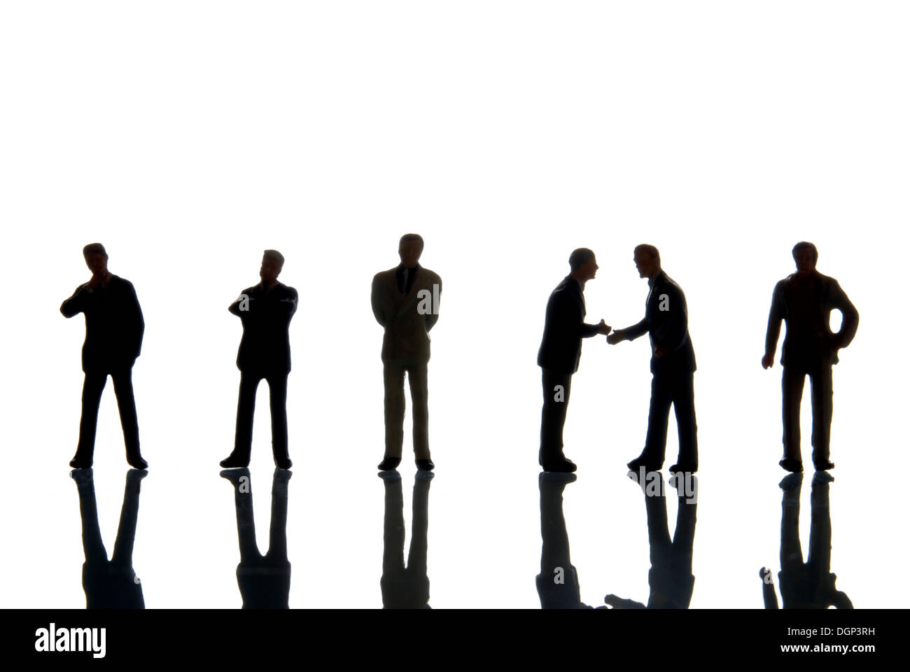 Row of businessmen figures, silhouettes Stock Photo