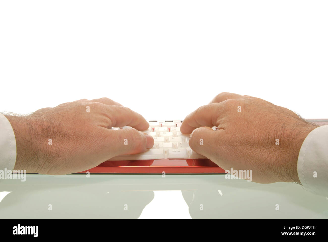 Man's hands on a red keyboard Stock Photo