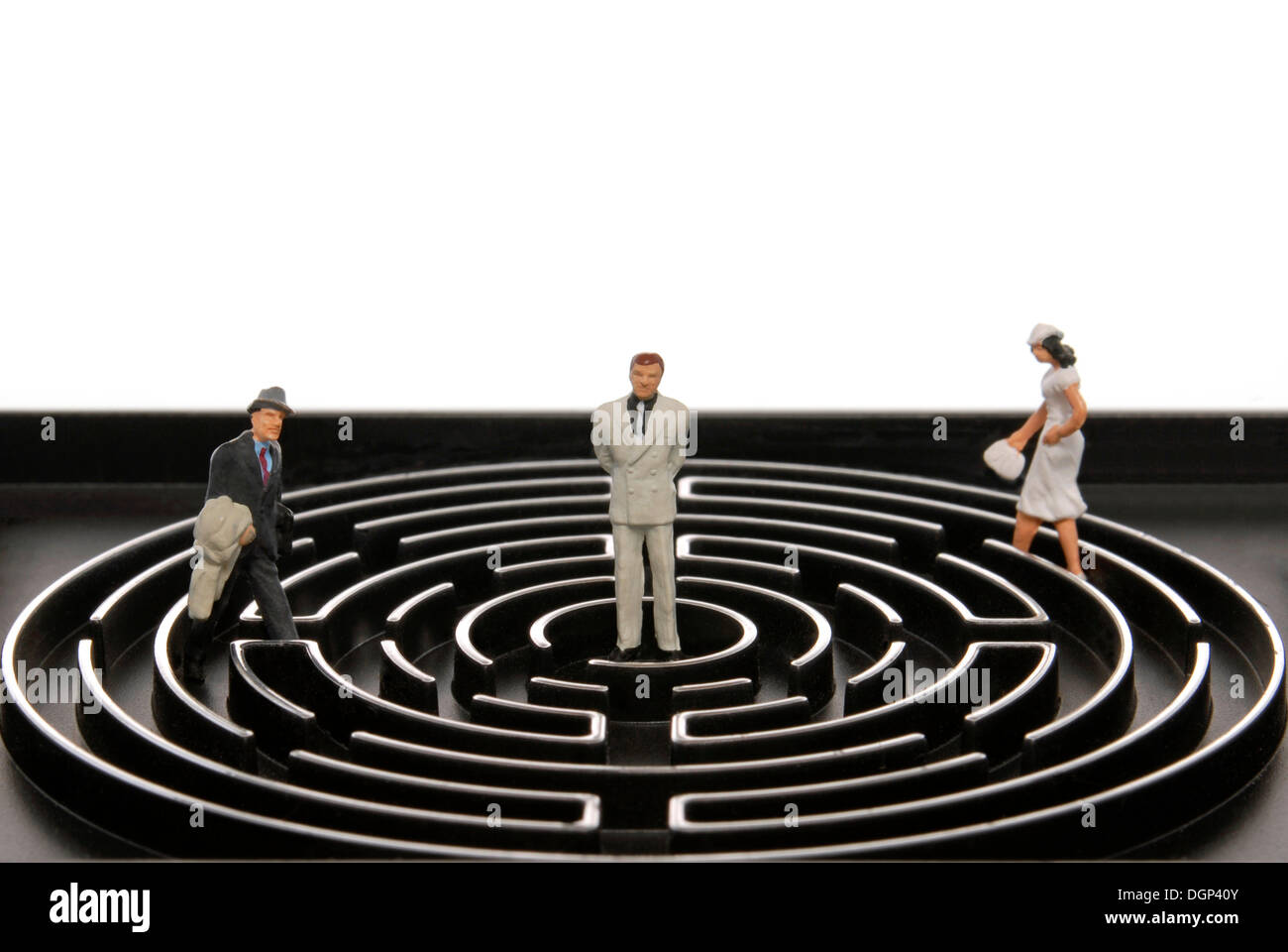 Small business man figures walking in a labyrinth Stock Photo