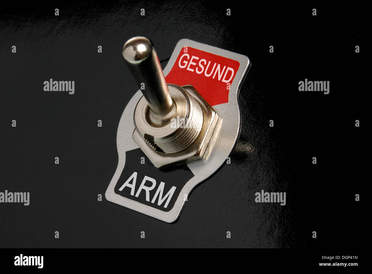 Toggle switch, labelled Arm and Gesund, German for poor and healthy, symbolic image Stock Photo