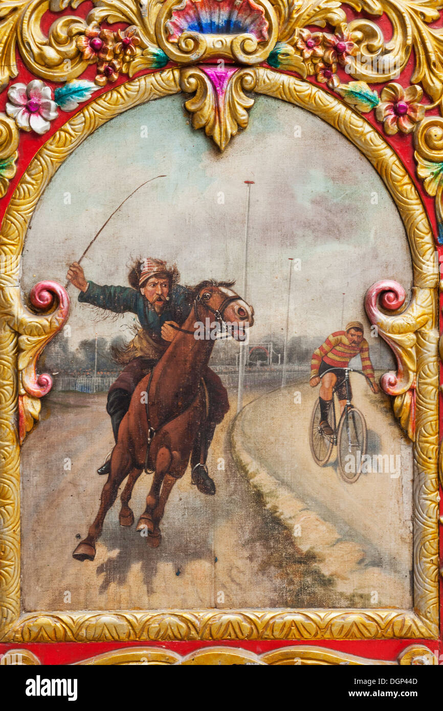 Dingles Fairground Heritage Centre, Hatwell Panel by Henry Whiting of Norwich Featuring Race Between Cyclist and Horseback Rider Stock Photo