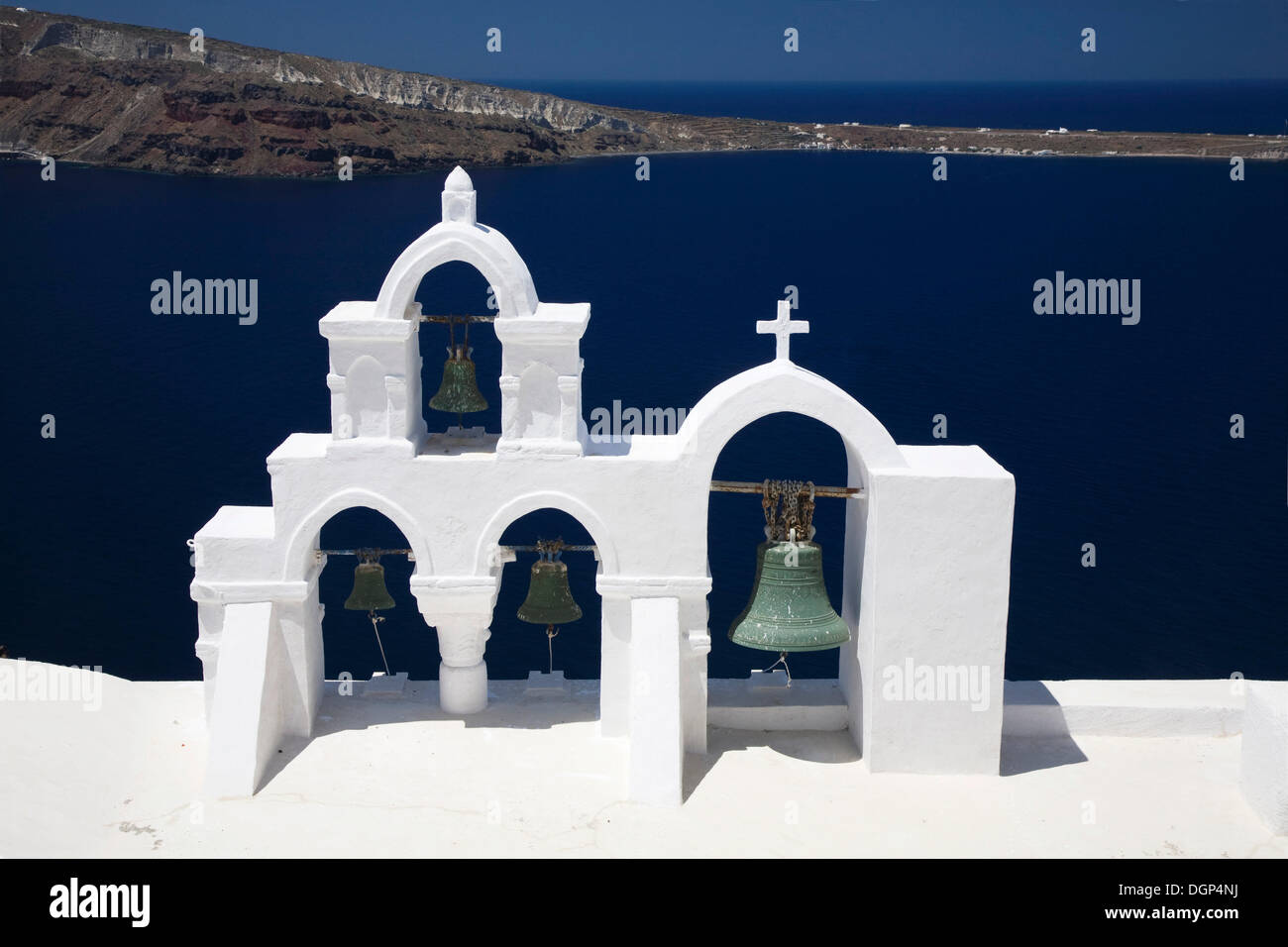 White bell tower in front of the blue Aegean, Oia, Santorini, Cyclades, Greece, Europe Stock Photo