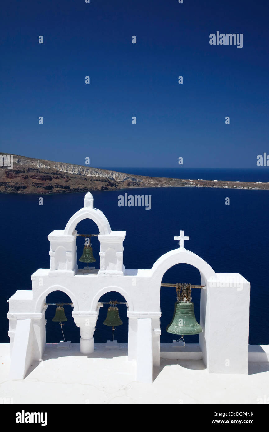 White bell tower in front of the blue Aegean, Oia, Santorini, Cyclades, Greece, Europe Stock Photo