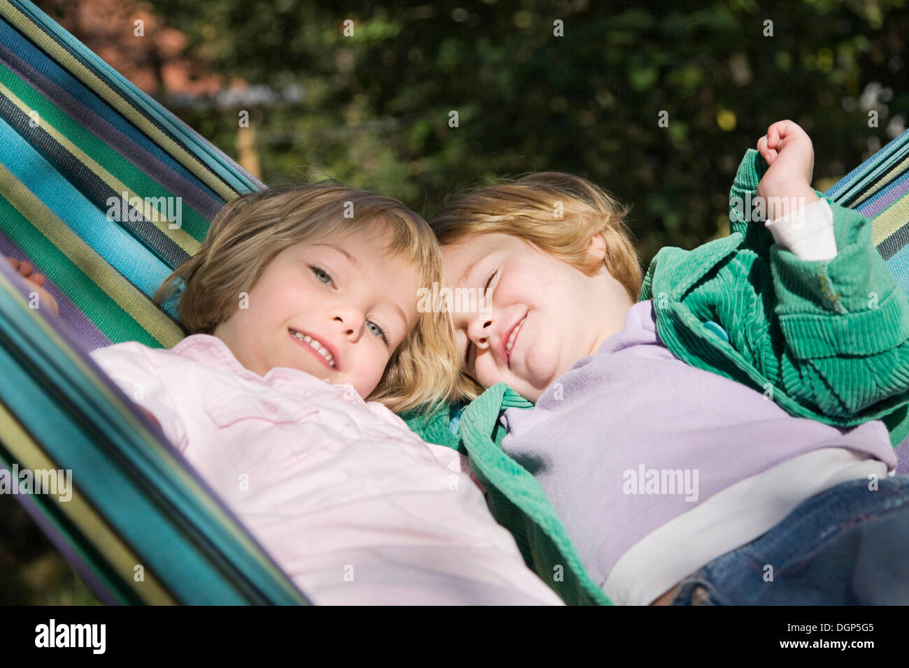 Two girls in a hammock Stock Photo