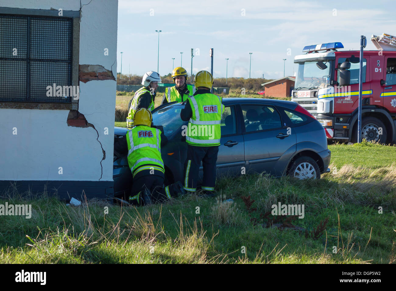 Redcar and Cleveland, UK . 24th Oct, 2013. Emergency services attending a road traffic accident on Redcar and Cleveland England UK Seafront where a woman driver has driven her car off the road and collided with Public Toilet block severely damaging the car and the Building Credit:  Peter Jordan NE/Alamy Live News Stock Photo