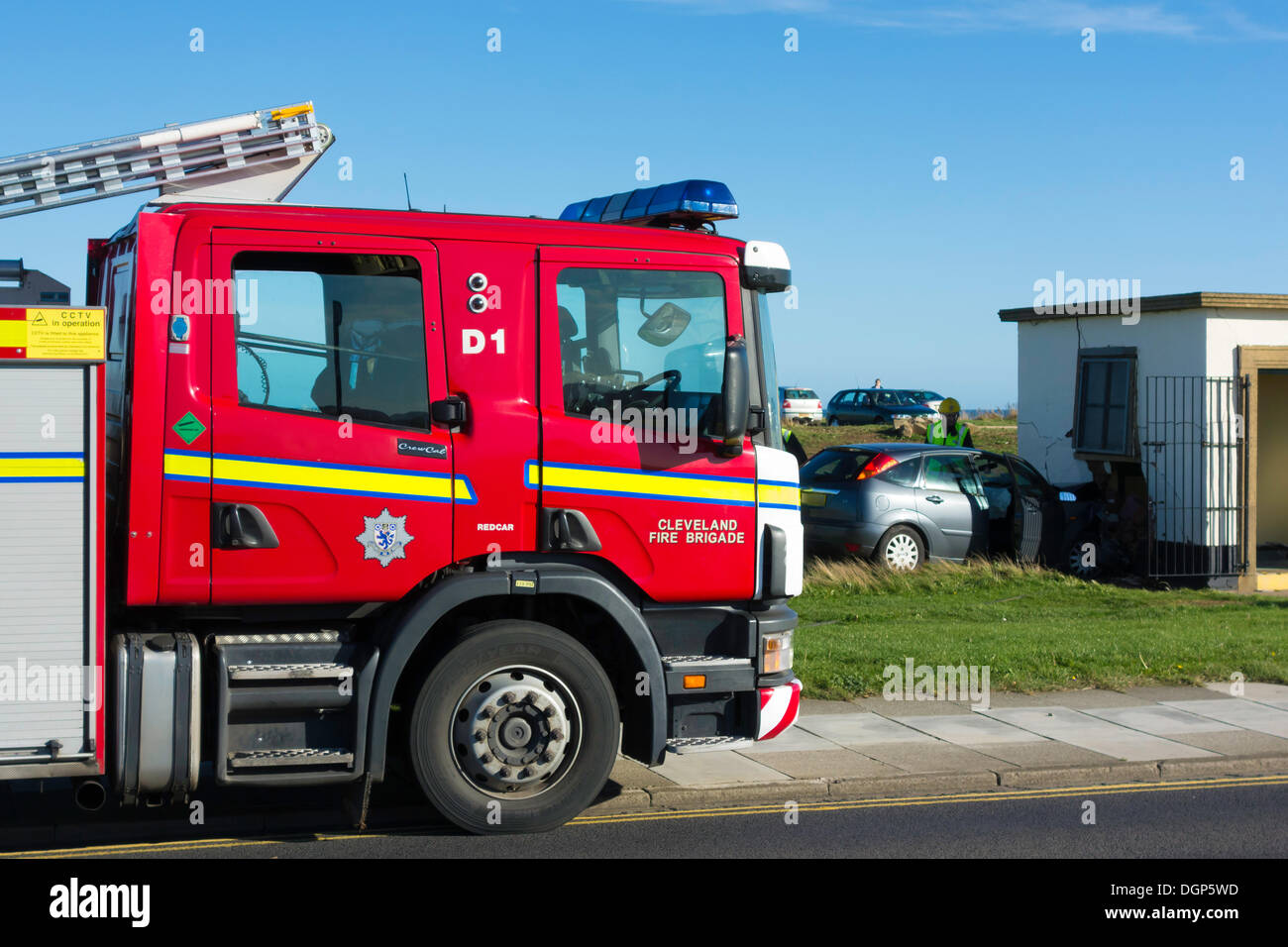 Redcar and Cleveland, UK . 24th Oct, 2013. Emergency services attending a road traffic accident on Redcar and Cleveland England UK Seafront where a woman driver has driven her car off the road and collided with Public Toilet block severely damaging the car and the Building Credit:  Peter Jordan NE/Alamy Live News Stock Photo