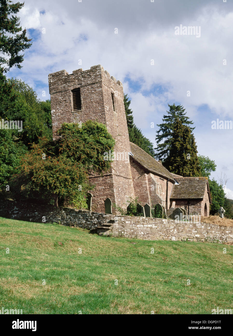 Tower and chancel of Cwmyoy Medieval church, Monmouthshire, have been twisted in opposite directions by slippage of the loose sandstone hillside. Stock Photo
