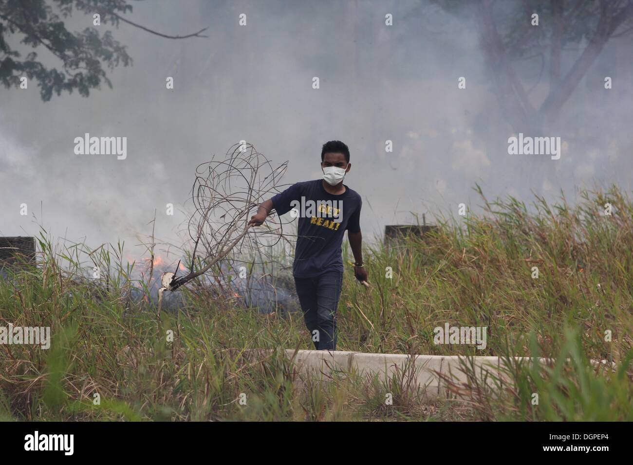 Batam, Indonesia. 23rd Oct, 2013. Protestors burn during riot in Batam ...