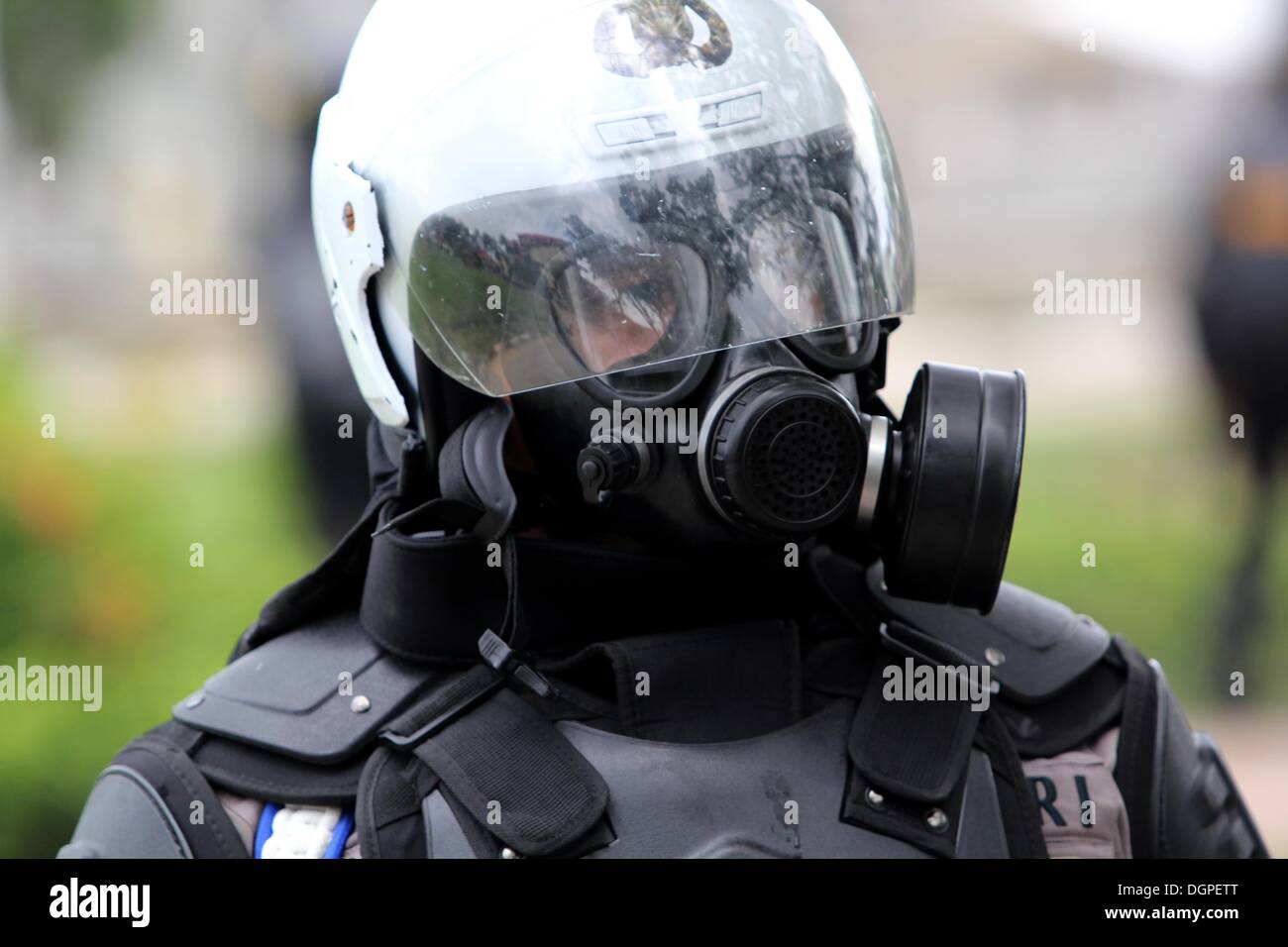 Batam, Indonesia. 23rd Oct, 2013. Police defend and repel demonstrators ...