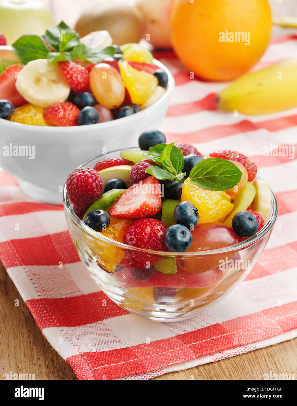 Chopped fresh fruits arranged on cutting board on white wooden surface, top  view. Ingredients for fruit salad. From above, flat lay, overhead Stock  Photo - Alamy