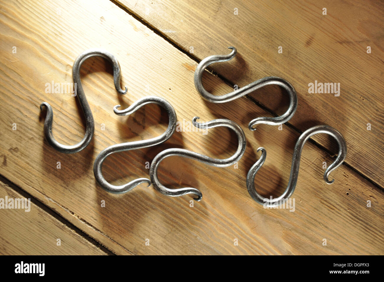 A collection of butcher's metal hooks UK Stock Photo Alamy