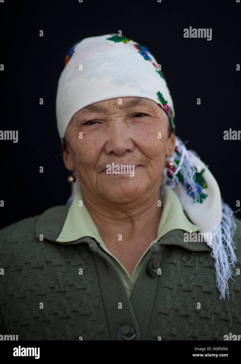 Old Woman Wearing A Headscarf At The Animal Market Of Kochkor