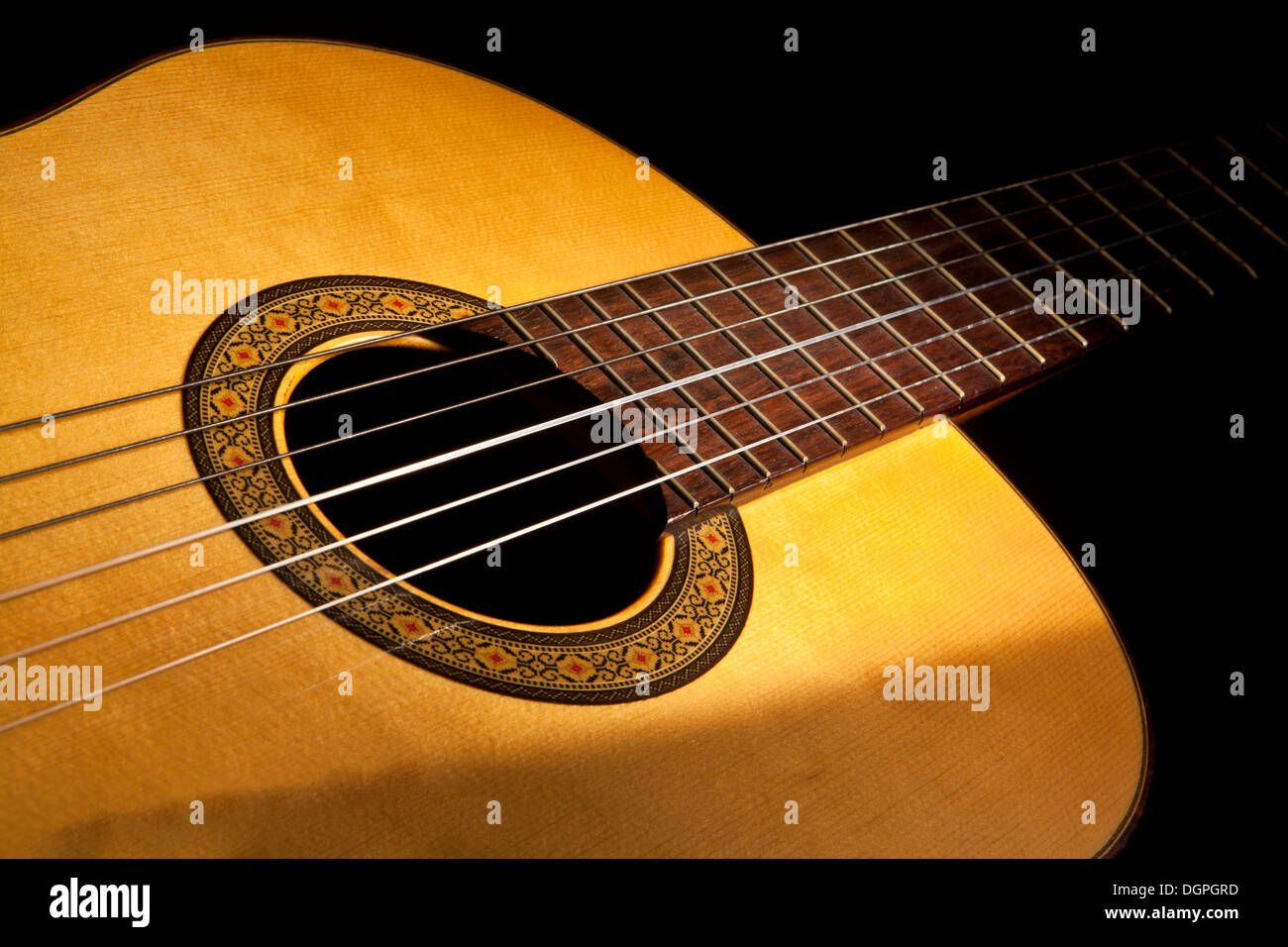 Classic Guitar With a Selective Light Stock Photo