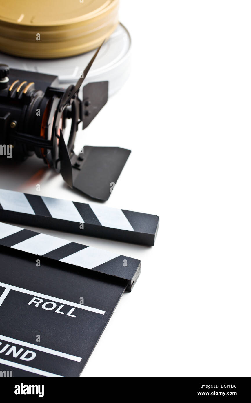 clapper board with movie light and film reel on white background Stock Photo