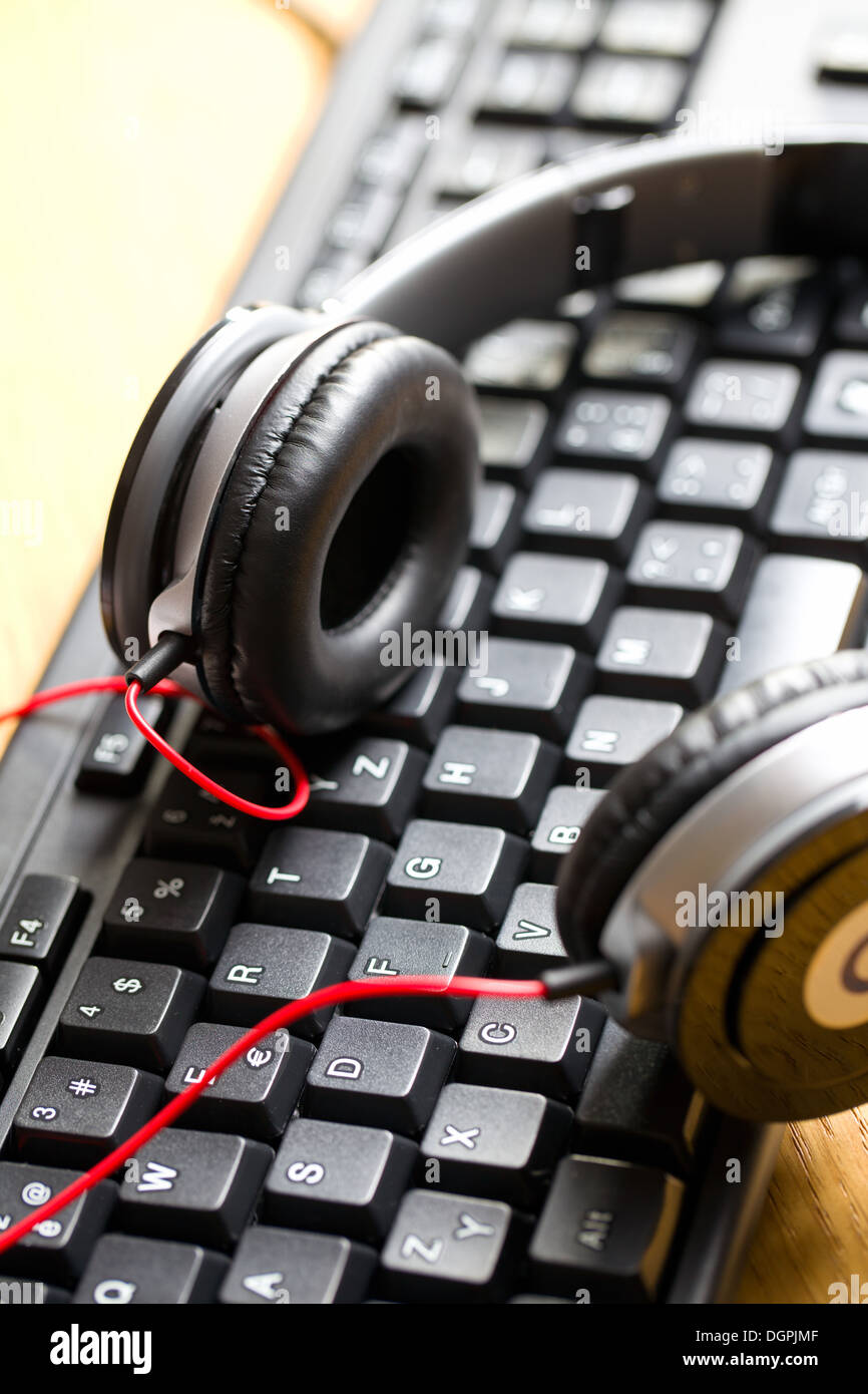 close up of headphones with keyboard Stock Photo Alamy