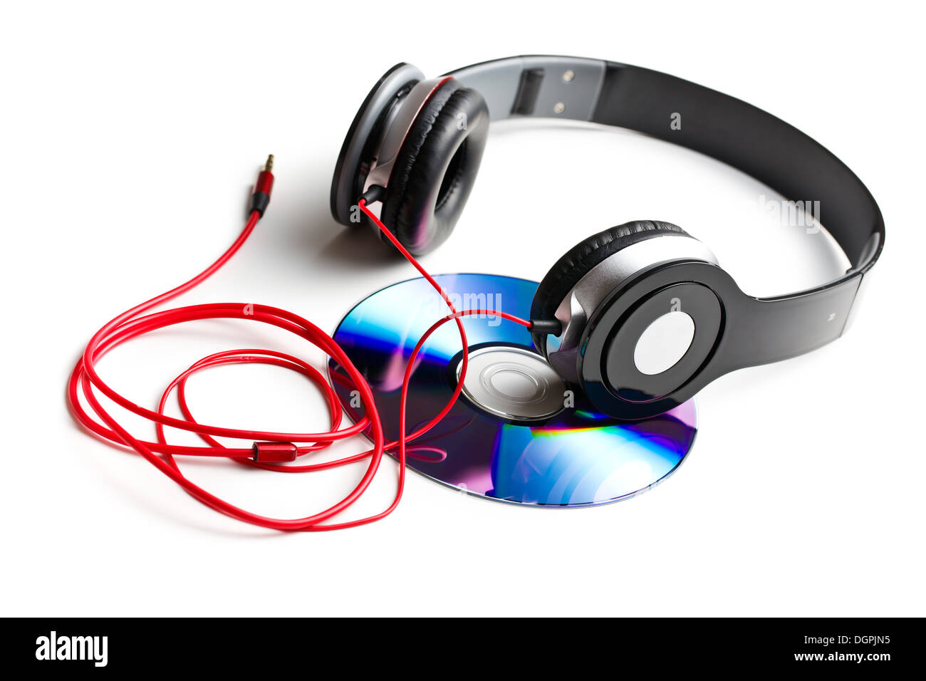 black headphones with cd on white background Stock Photo