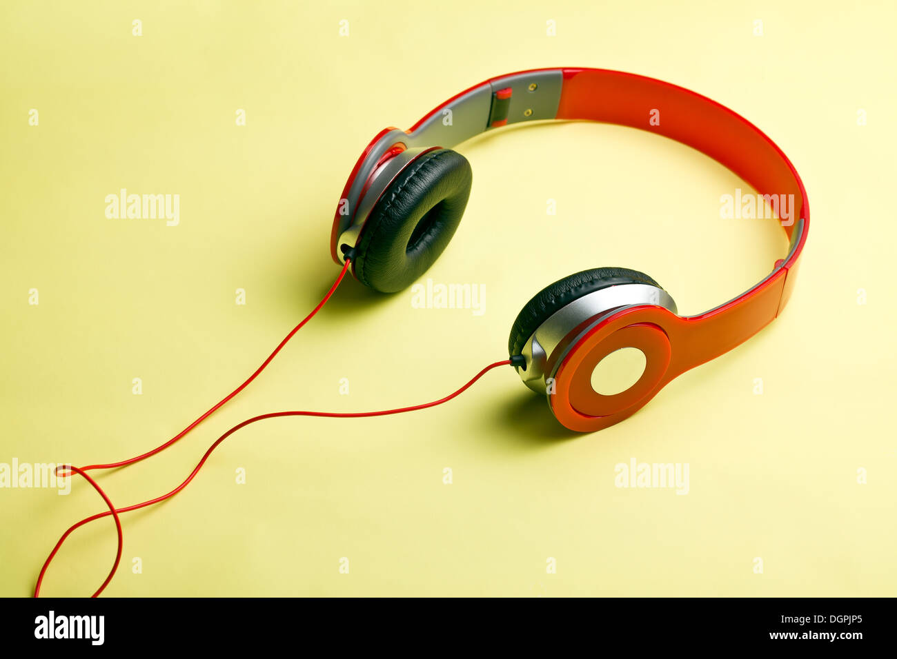 red headphones on yellow background Stock Photo