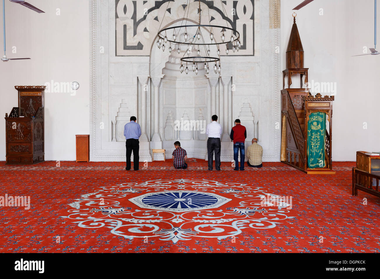 Muslims praying in the prayer room of the İsabey Mosque, Selçuk, İzmir Province, Aegean Region, Turkey Stock Photo