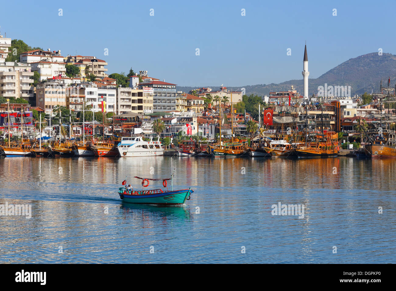 Excursion boats and a fishing boat in the harbour, Alanya, Turkish Riviera, Province of Antalya, Mediterranean Region, Turkey Stock Photo