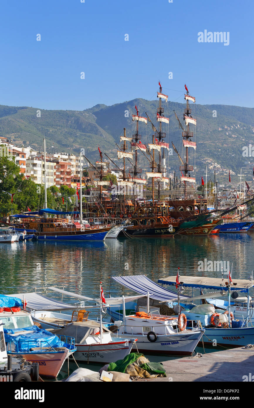 Fishing boats and excursion boats in the harbour, Alanya, Turkish Riviera, Province of Antalya, Mediterranean Region, Turkey Stock Photo