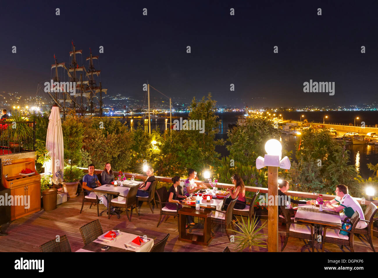 Restaurant at the harbour at night, Alanya, Turkish Riviera, Province of Antalya, Mediterranean Region, Turkey Stock Photo