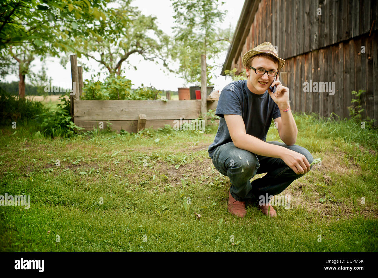 Young farmer speaking on a mobile phone Stock Photo