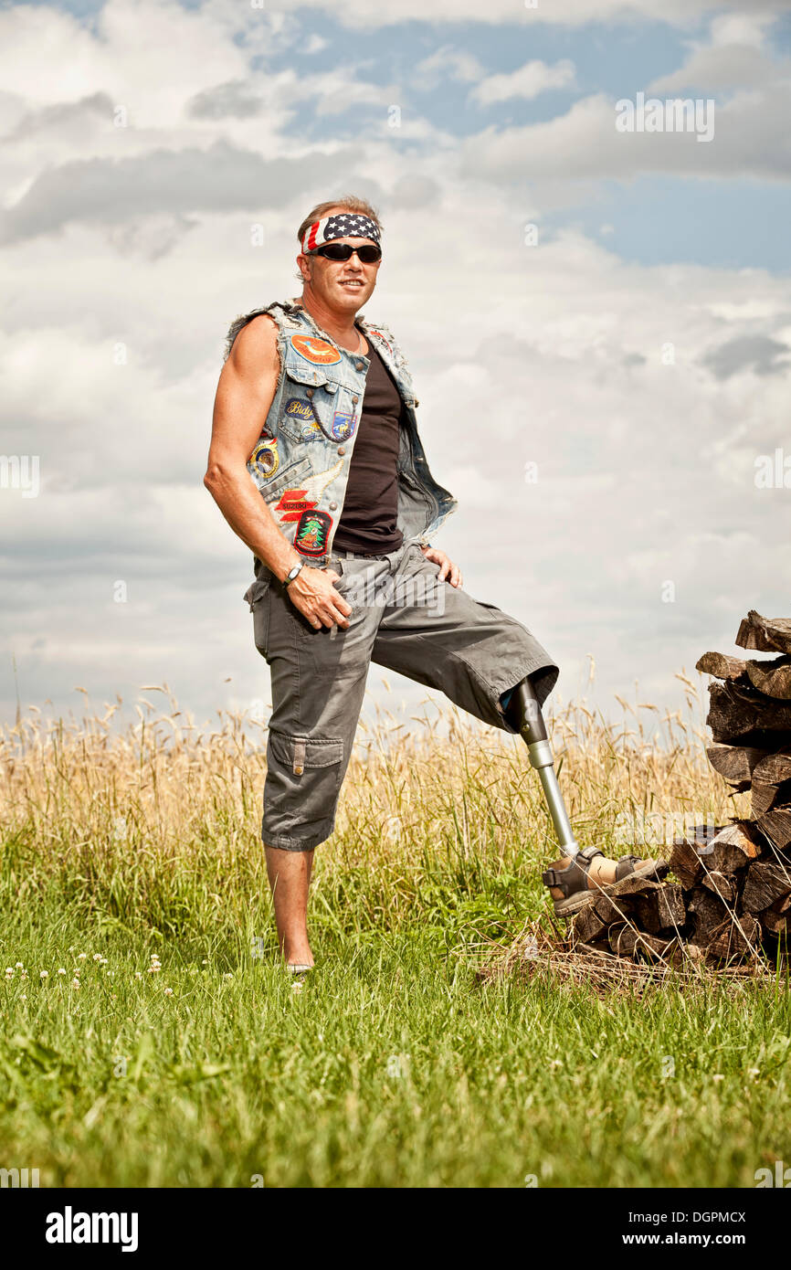 Biker with a prosthetic leg Stock Photo