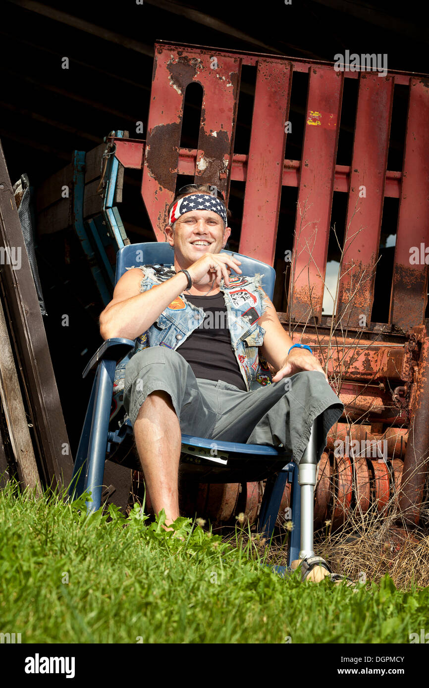 Biker with a prosthetic leg Stock Photo