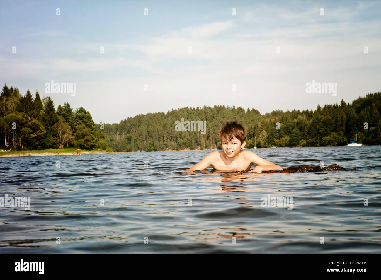 Boy swimming in a lake Stock Photo
