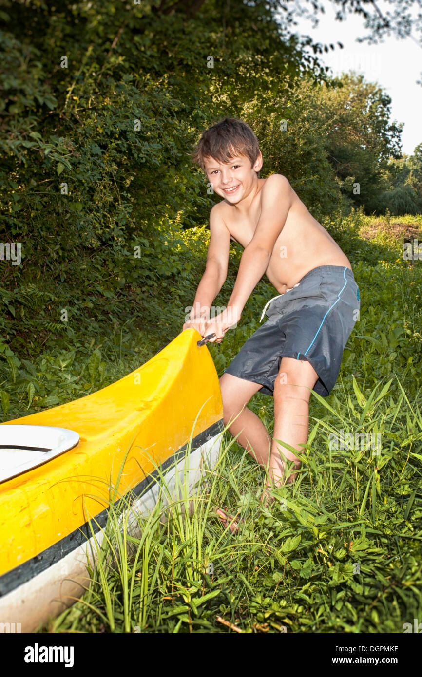Boy with his canoe Stock Photo