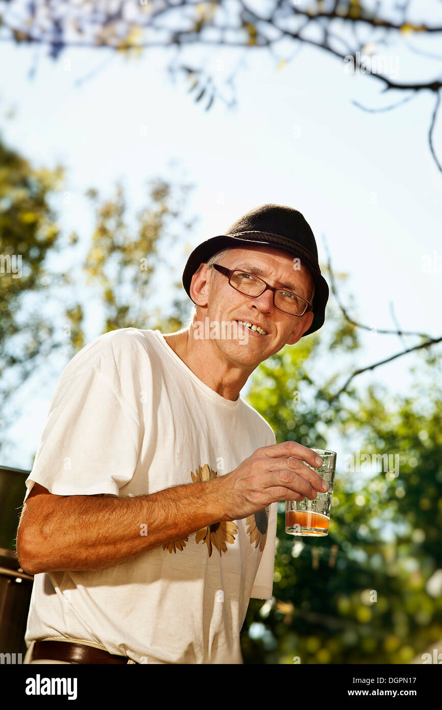 Man with freshly squeezed apple juice Stock Photo
