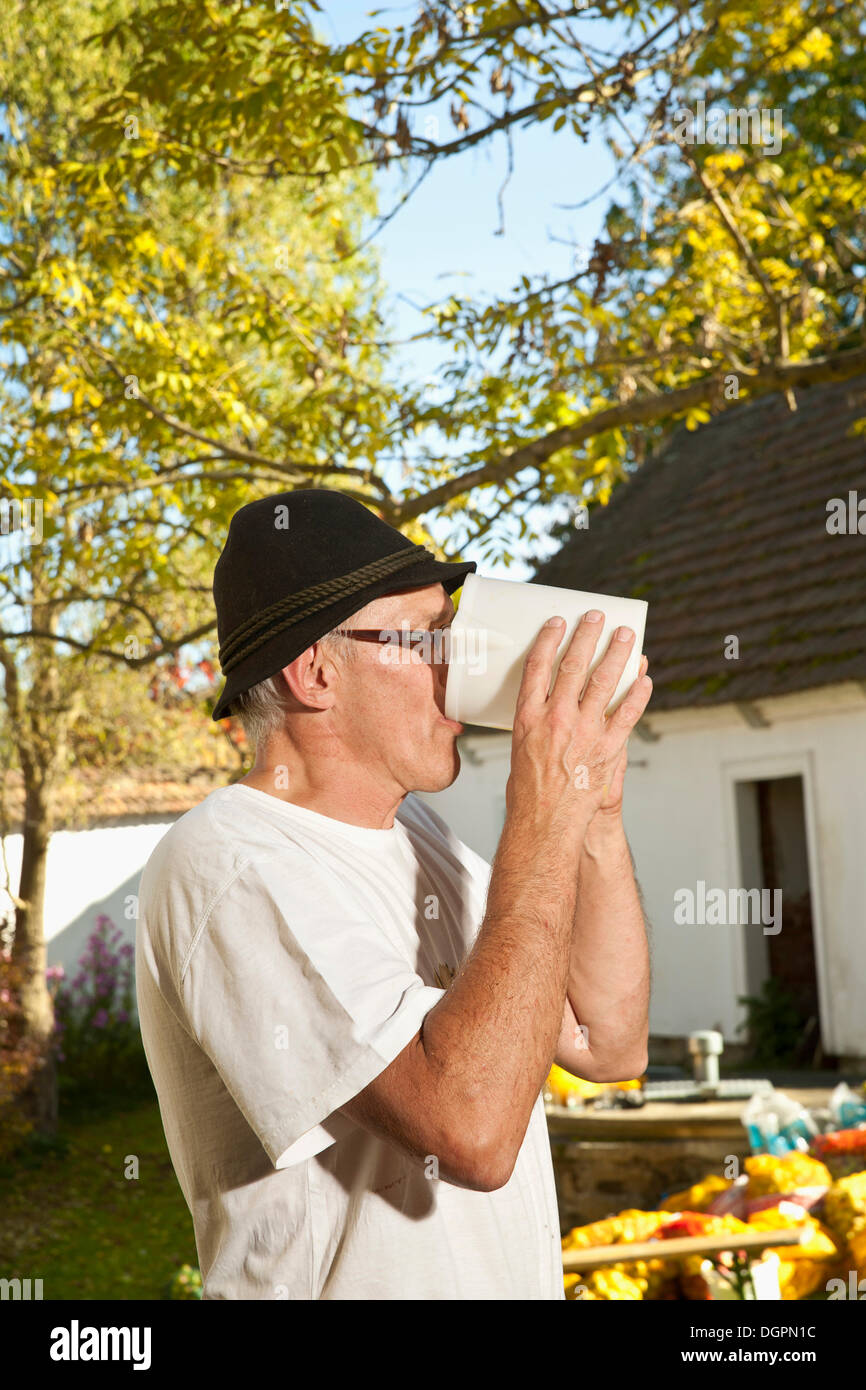 Man drinking freshly squeezed apple juice Stock Photo