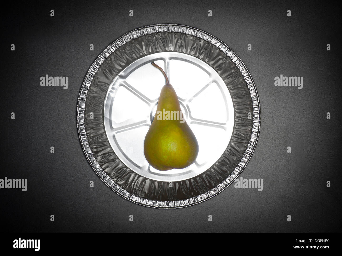 Pear In Metal Pie Plate Stock Photo
