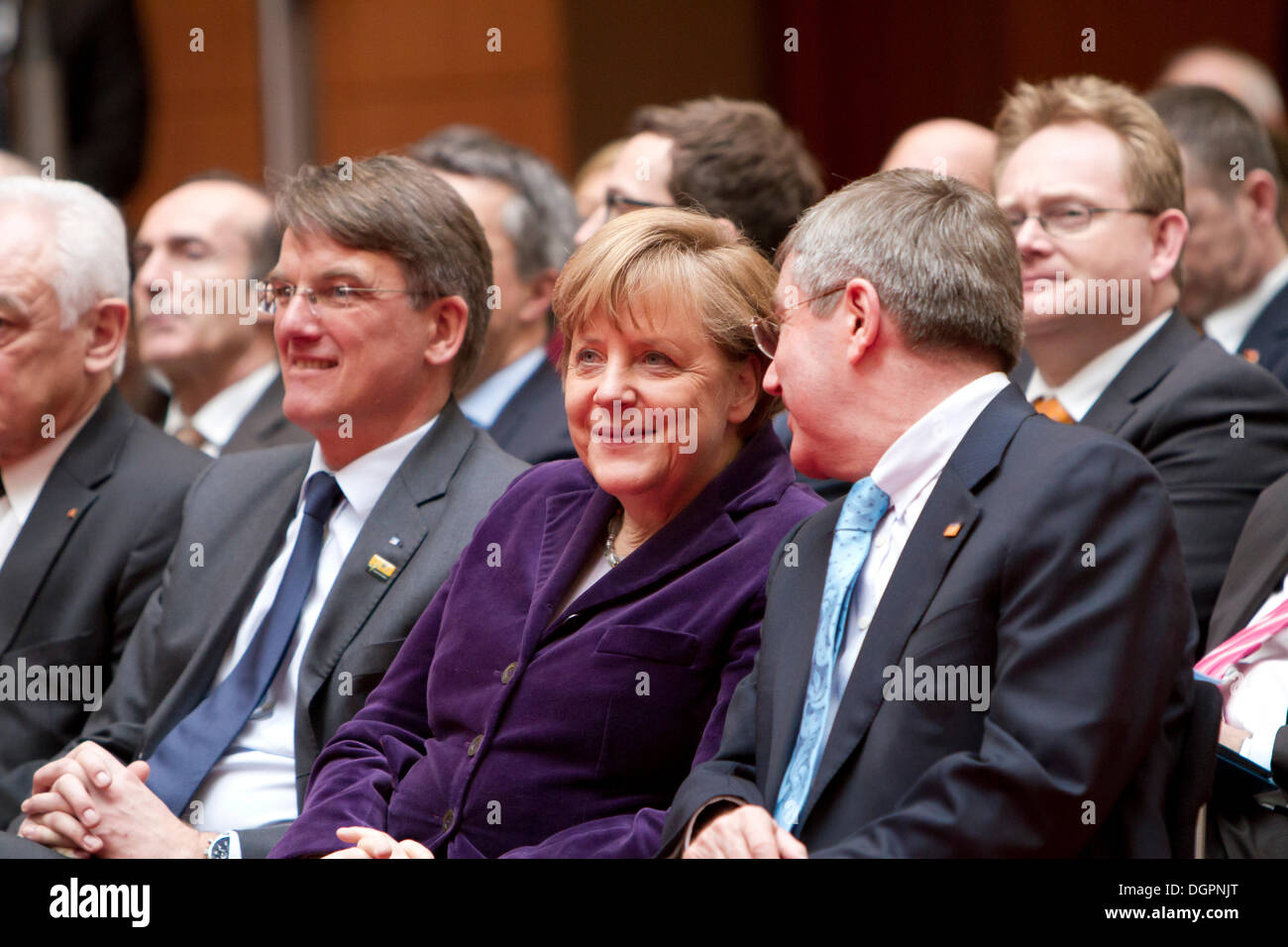 From left to right: Uwe Froehlich, President of the Federal Association of German Cooperative Banks, BVR, Angela Merkel, German Stock Photo