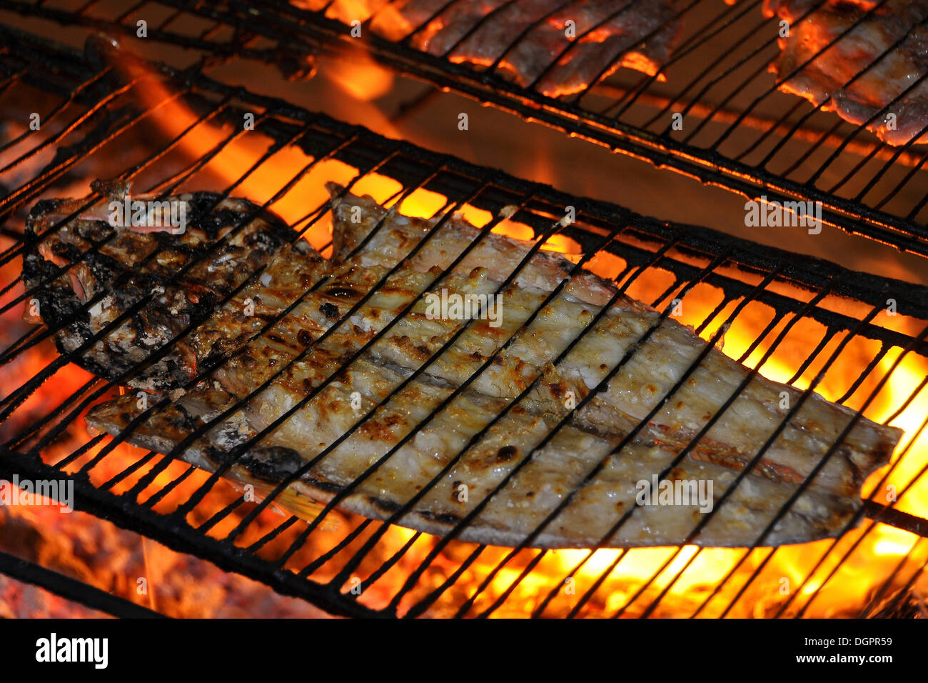 Sea fish on a charcoal grill, Jericoacoara, Ceará, Brazil, South America Stock Photo