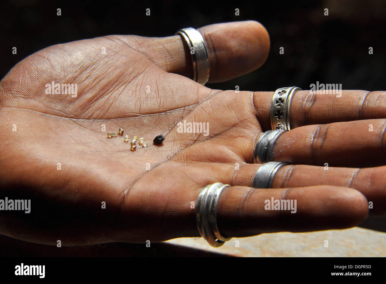 Hand holding rough diamonds, Chapada Diamantina, Bahia, Brazil, South America Stock Photo