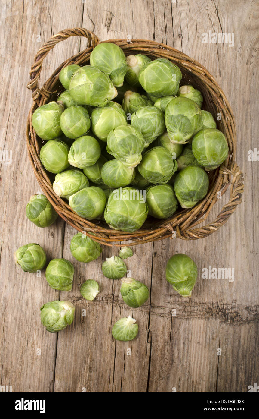 brussel sprout in a basket on a country style wooden table Stock Photo